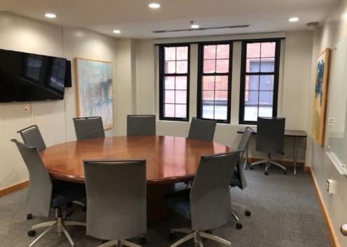 Roundtable Room with fixed seating for 8 around a round table